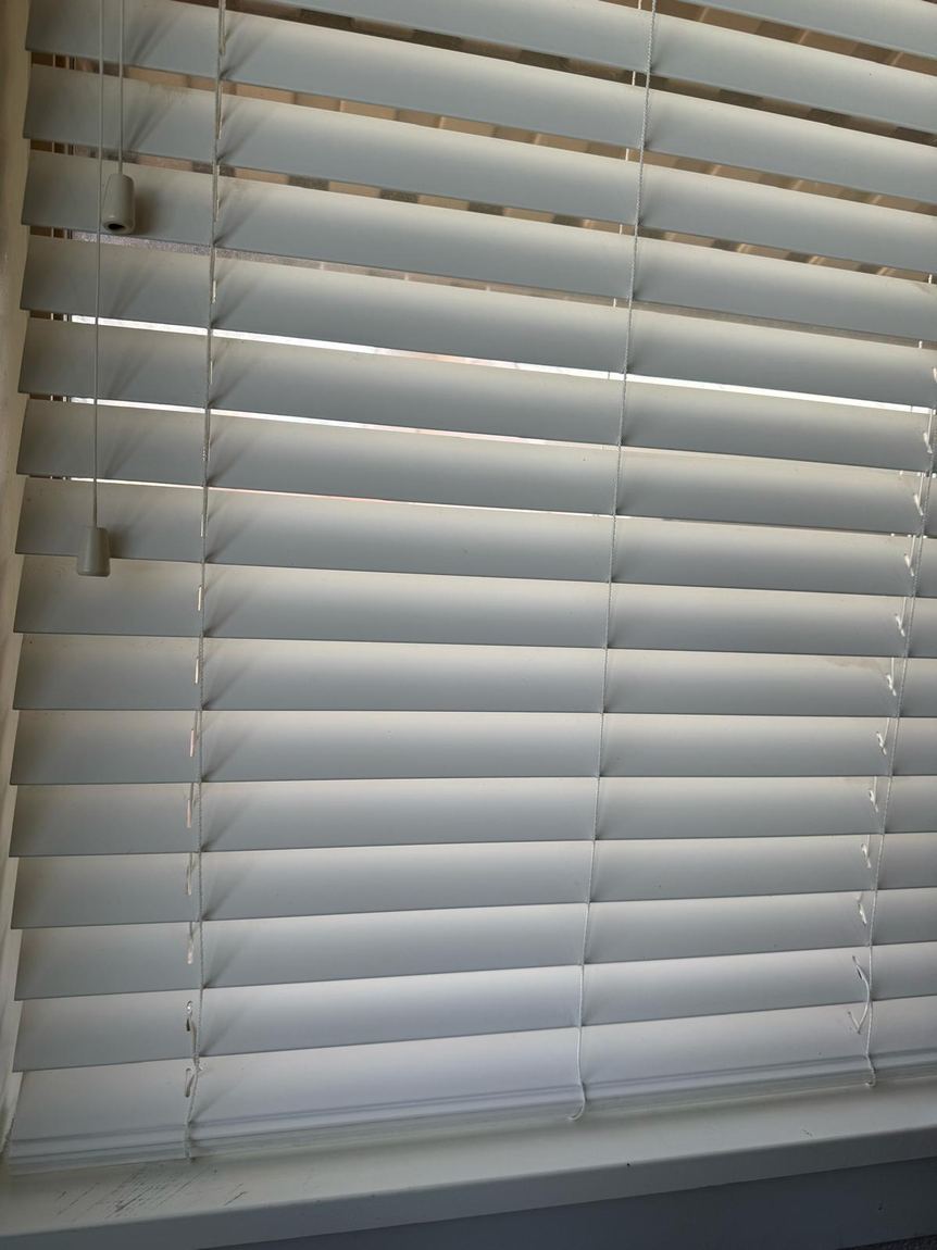 The same blinds after cleaning, bright and white