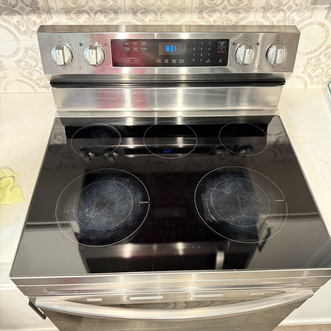 A glass cooktop wiped clean with no marks left on the surface