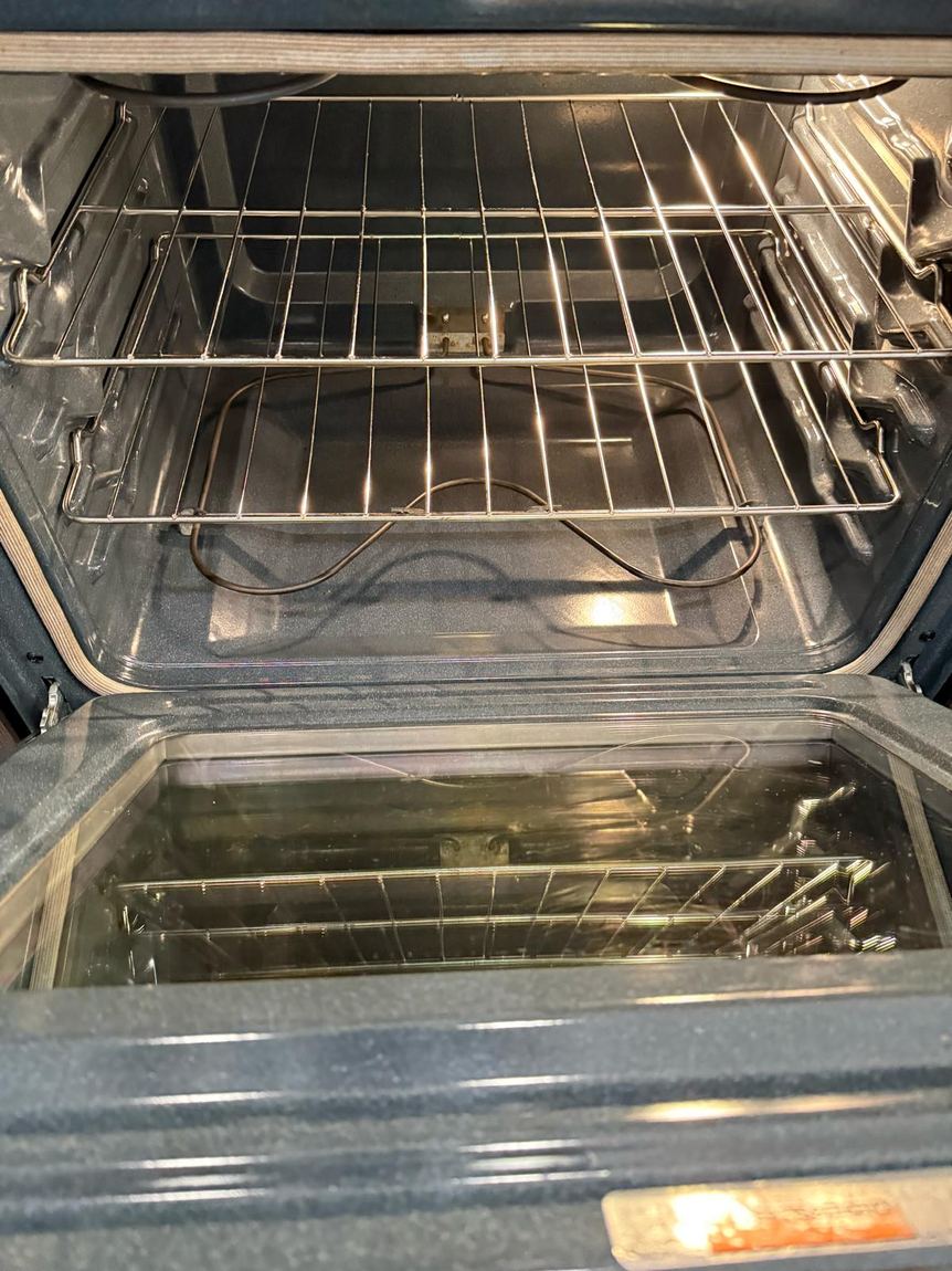 The same oven after cleaning, racks and interior spotless